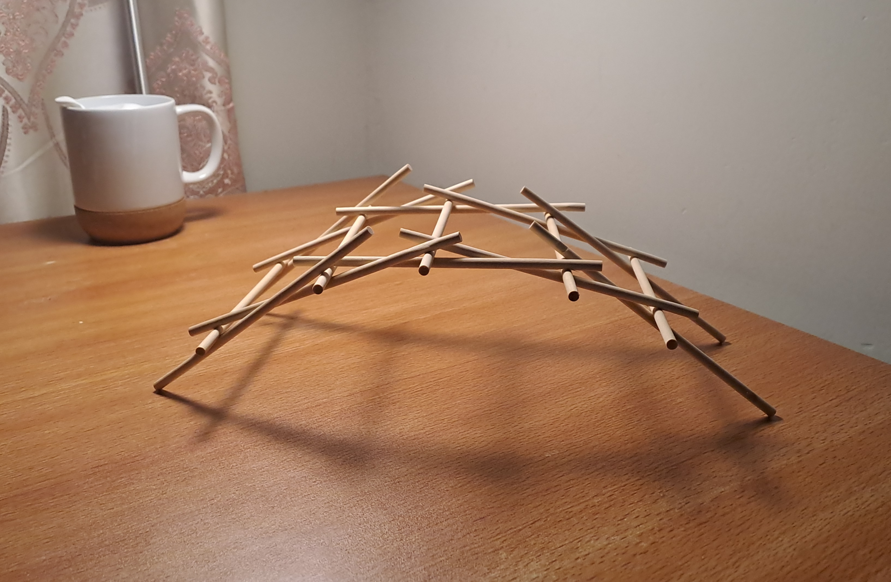 The picture of Da Vinci bridge made up of wooden sticks