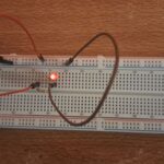 LED light bulb being light up on the breadboard.