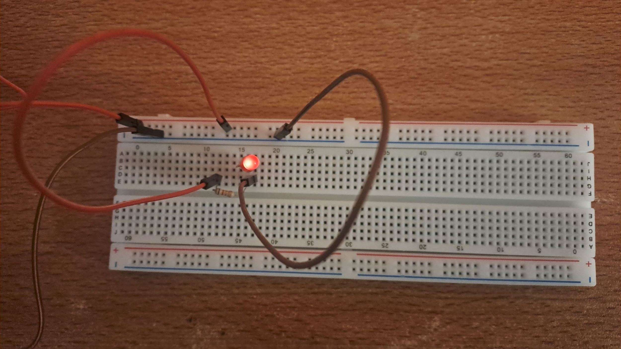 LED light bulb being light up on the breadboard.